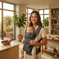 Mom wearing Contours Journey 5-in-1 ergonomic baby carrier with UPF sunshade, ASTM certified